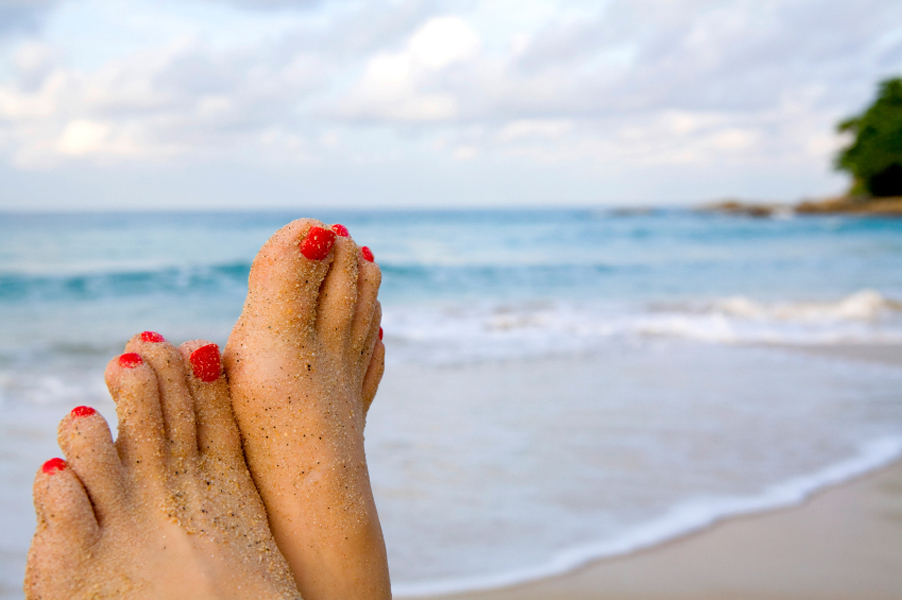 Woman's feet on the beach